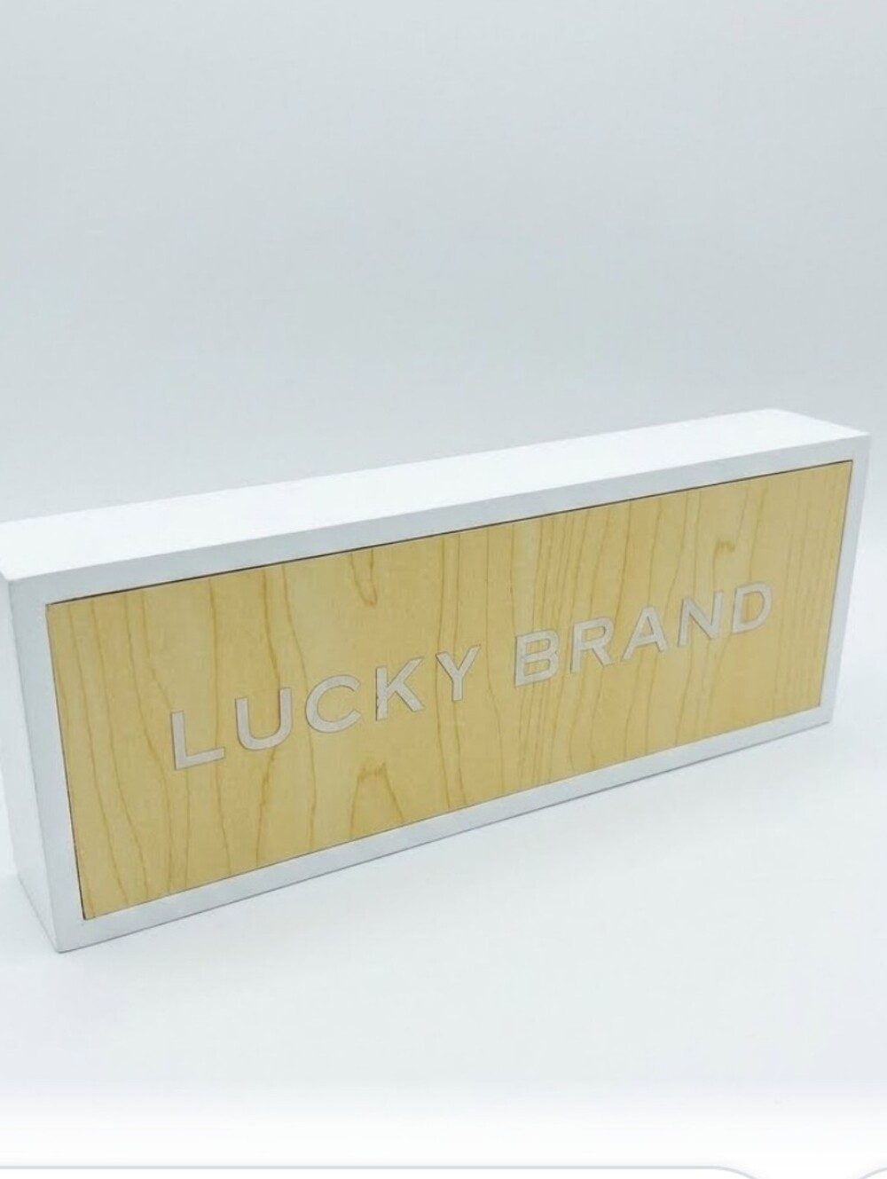 Lucky Brand Display Sign in White and Light Wood 3x8 Inches
